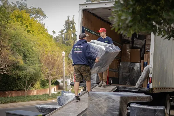 Best California Movers crew loading wrapped furniture into a moving truck